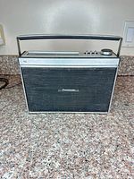Front view of Panasonic RF-923 radio showing speaker grille, handle and antenna