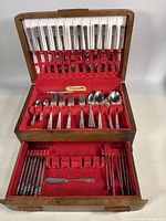 Chest open showing full flatware set