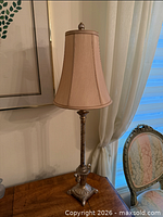 Full view of lamp on table showing shade and base