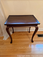 overall view of dark wood accent table front angle
