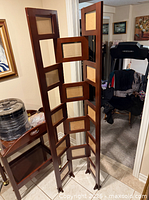 Full view of the wooden folding photo display screen standing open