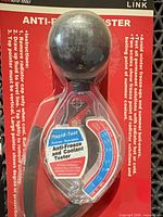 Front view of sealed JTC Auto Link antifreeze tester showing gauge, bulb, tubing