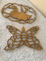 Both brass coasters side by side