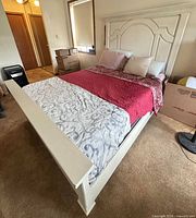 Bed frame assembled with mattress, showing headboard, footboard and side rails
