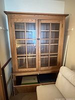 Front view of hutch bookcase showing glass doors and lower cabinet
