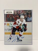 Front view of signed 8×10 Pageau photo in sleeve