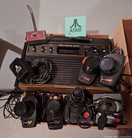 Console, controllers, power adapter, RF switch grouped in box