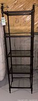 full front view of metal and glass shelving unit