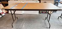 Top view of folding table showing laminate surface and size reference