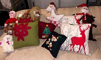 All pillows and stuffed toys arranged on couch
