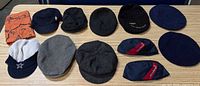 All 12 hats laid out in two rows