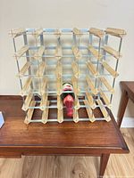 Front view of wine rack with single bottle inserted