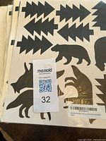 Black silhouette decal sheet with trees, bear and fox shapes