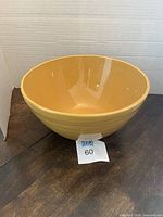Top angled view of yellow Primagera ceramic bowl