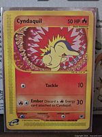 Front of Cyndaquil 105/165 card in sleeve