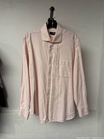 Front view of pink Le 31 men’s long-sleeve shirt hanging on hanger