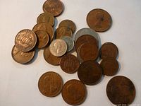 Group view of mixed British coins, various sizes and metals