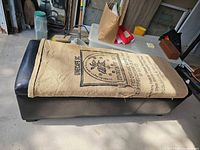 Full top view of ottoman with burlap cover