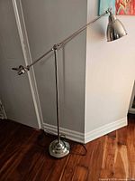 Full view of the brushed nickel adjustable floor lamp