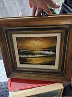 Framed seascape painting overall view