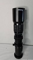 Full view of Ultimaxx telephoto lens showing overall condition