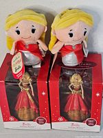 Two plush itty bittys Barbie dolls and two boxed Holiday Barbie ornaments