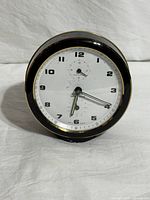Front view of the Wehrle alarm clock showing face and overall condition