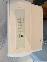 Top control panel close-up with digital display and function icons
