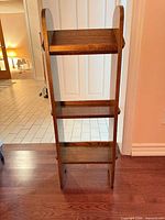Front view of solid wood three-shelf ladder etagere