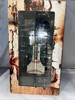 Front view of boxed Ichiro bobblehead showing figure and windowed packaging