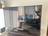 Front view of Philips 40-inch TV on stand