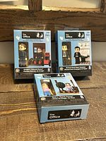 All three sealed The Office buildable figure boxes displayed