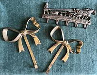 Lot overview showing two bow hooks and plow scene key rack