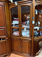 Full view of Harden china cabinet showing glass upper doors, wood lower doors, shelves and hardware