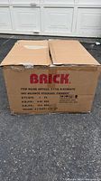 Sealed shipping box labeled Brick T-1136 B-003 WHITE