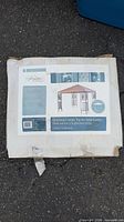Front of box showing Greystone Garden matching canopy top for Tulip Gazebo, box wear visible