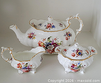 Full view of teapot, creamer, sugar bowl displaying pattern and shape