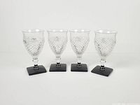 Front view of four matching goblets
