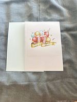 Front of the 17th birthday pop-up greeting card with accompanying envelope