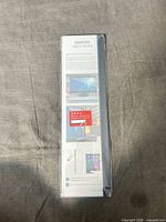 Front of sealed package showing monitor memo board product and illustrations
