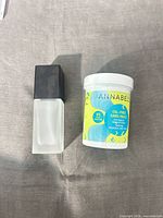 Annabelle remover pads jar beside frosted glass bottle