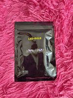 Front of black pouch with LED-BULB text