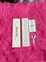 Stylus pen, USB cable, manual and box displayed