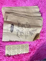 Stack of kraft paper bread bags with sticker sheet