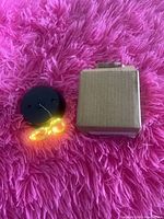 string lights illuminated alongside solar base and box