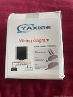 Front of Yaxige converter box showing logo and wiring graphic