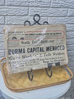 Front page showing full headline and taped edges