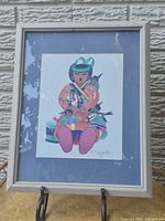 Front view of framed print showing artwork, mat and frame