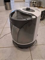 Front angled view of Sunbeam humidifier showing tank and housing