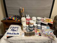 Full lot overview with paints, sketchbooks, brushes, markers